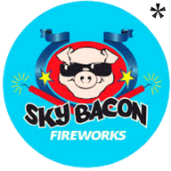 Sky Bacon Fireworks logo featuring a pig's face wearing dark sunglasses between a blue ribbon on a red background with a lighted firecracker. Purchase Sky Bacon Fireworks online at Elite Fireworks and receive shipment by the case straight to your door.